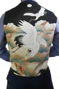 Detailed shot of a vest with a crane design inspired by traditional Japanese kimono art. Photo by Tia Haygood.