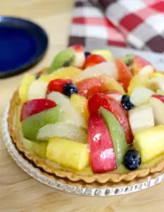 Close-up of a colorful fruit tart topped with fresh fruits, highlighting a delicious and vibrant dessert. Photo by Tia Haygood.