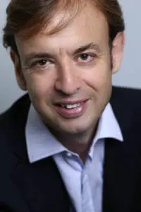 Professional headshot of James Marshall in a suit, exuding confidence and approachability. Photo by Tia Haygood.