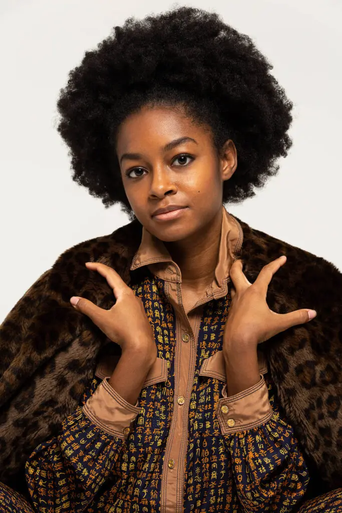 Headshot of a black woman in a unique fancy dress and coat facing the camera - Tokyo Portrait Photographer, Headshot photos