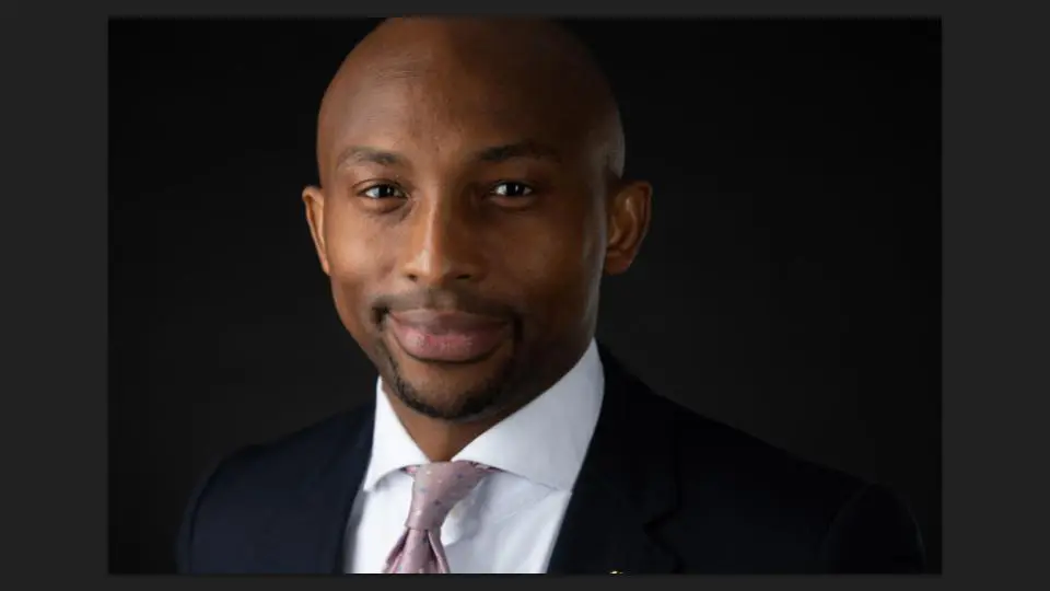 A professional young man in a black suit coat facing the camera with a smile - Tokyo Portrait Photographer, Headshot photos
