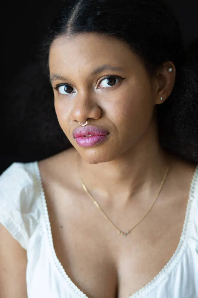 A closeup shot of a young woman in a white dress wearing septum piercing - Tokyo Portrait Photographer, Headshot photos