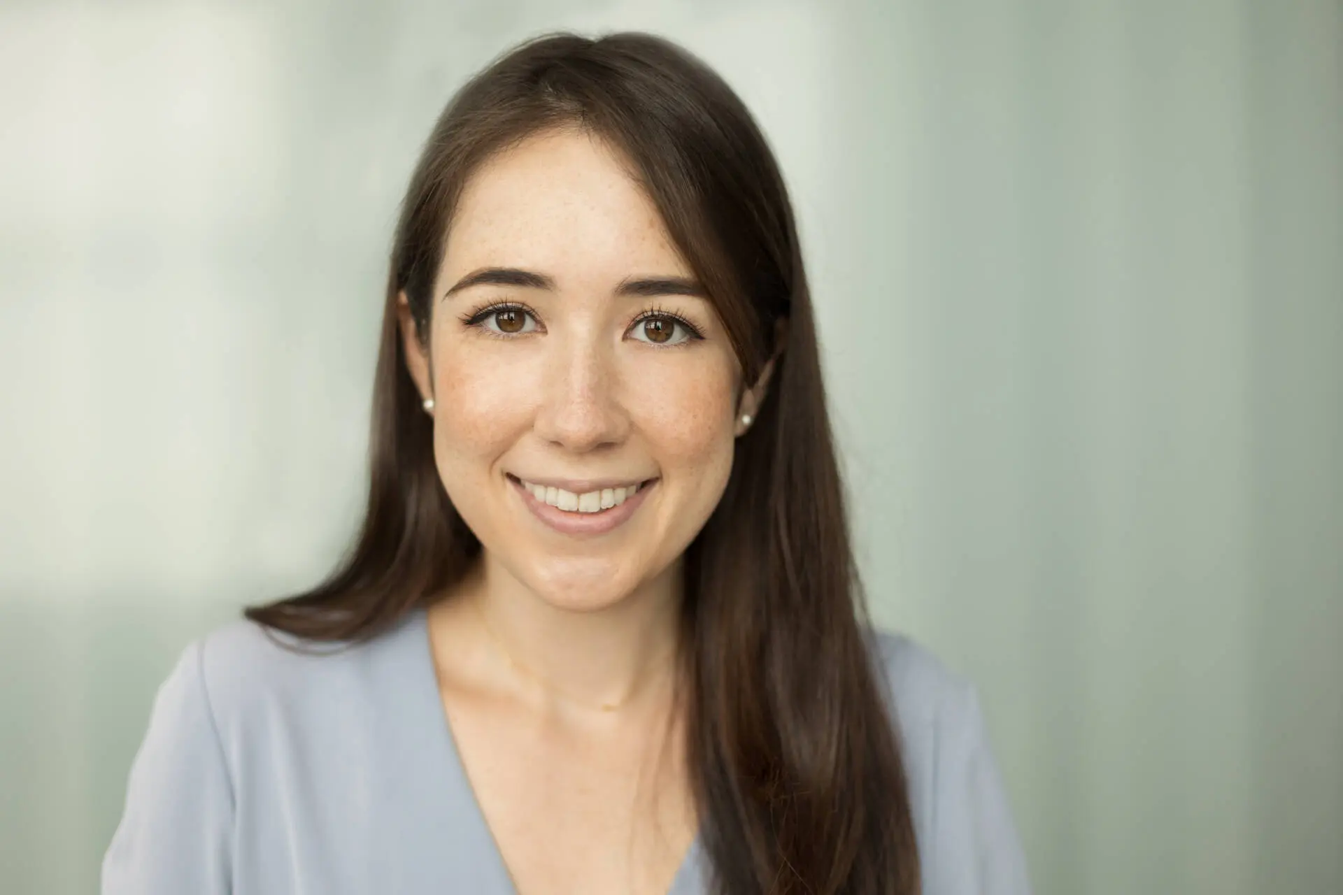Headshot of a young woman in a grey shirt smiling at the camera - Tokyo Portrait Photographer, Headshot photos