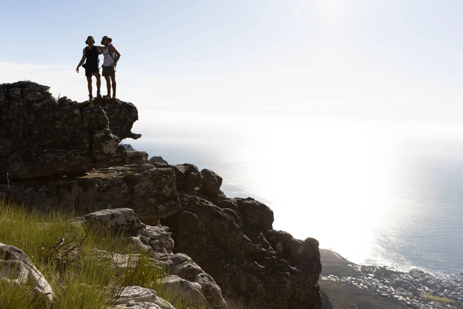 A long shot of two men on the cliff top near the beach posing in camera, Tokyo Portrait Photographer, Photographer in Tokyo