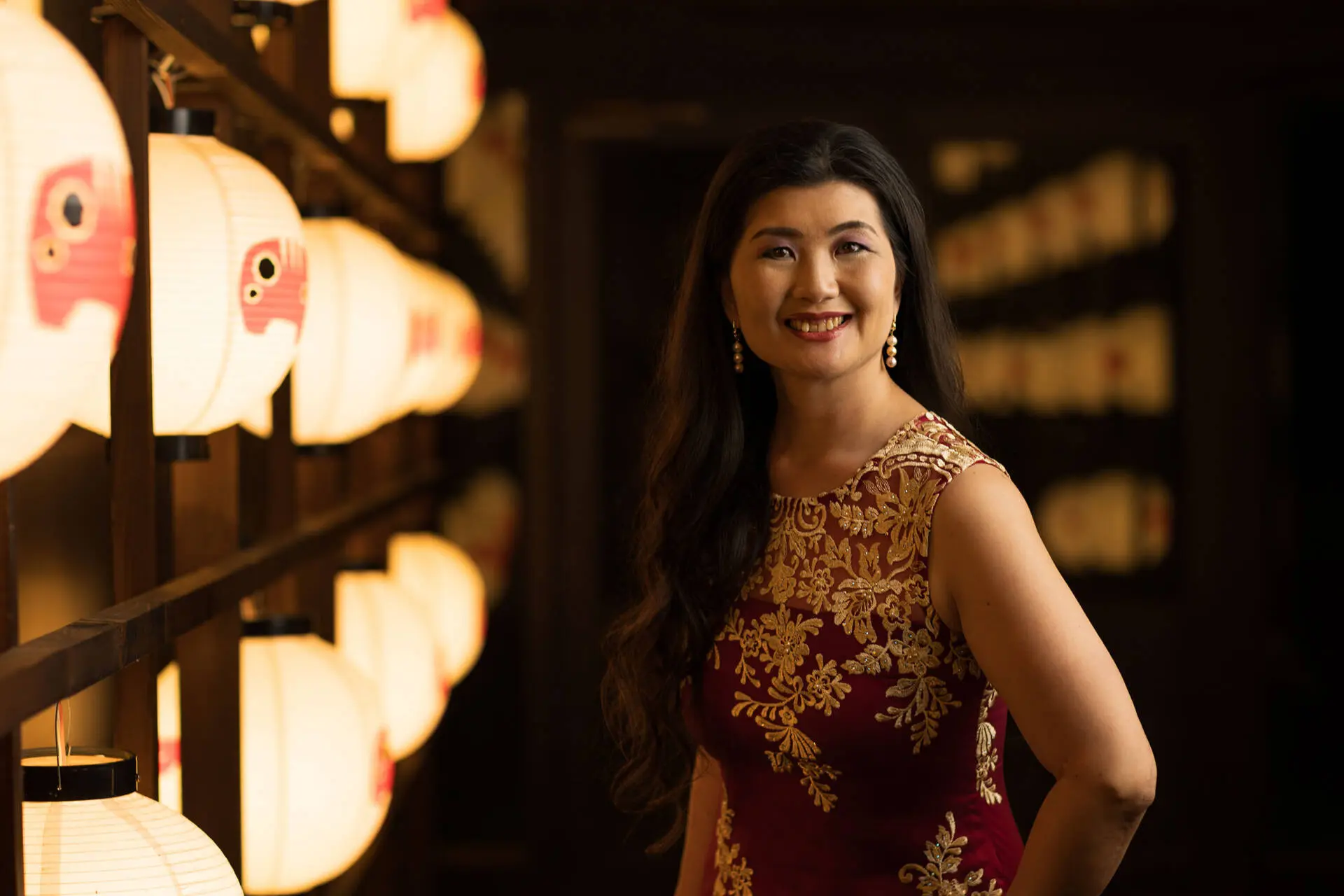 Beautiful shot of a young smiling woman wearing a Georgette Designer Palazzo Suit in red - Charlotte portrait photographer, Tokyo Portrait Photographer, Photographer in Tokyo