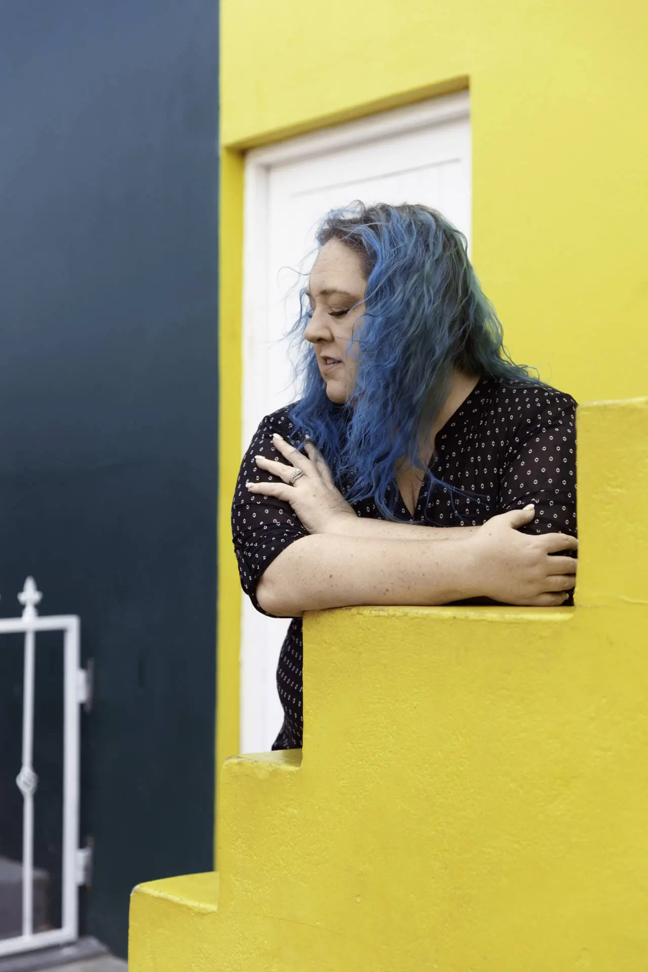 A fashionable woman with colored hair, posing alongside yellow stairs - Tokyo Portrait Photographer, Photographer in Tokyo, Tokyo Portrait Photographer