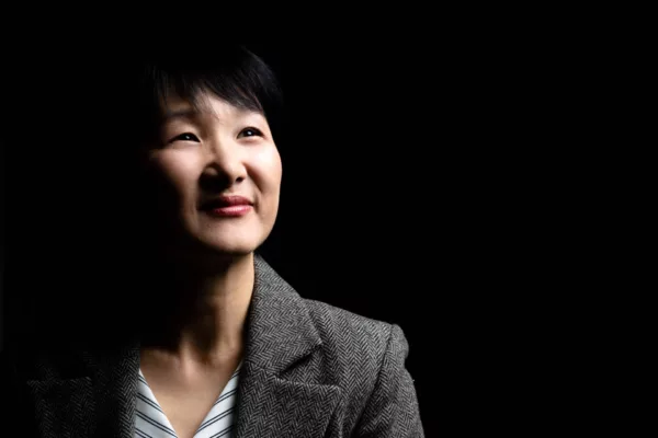 Low key portrait of inspiring female corporate executive