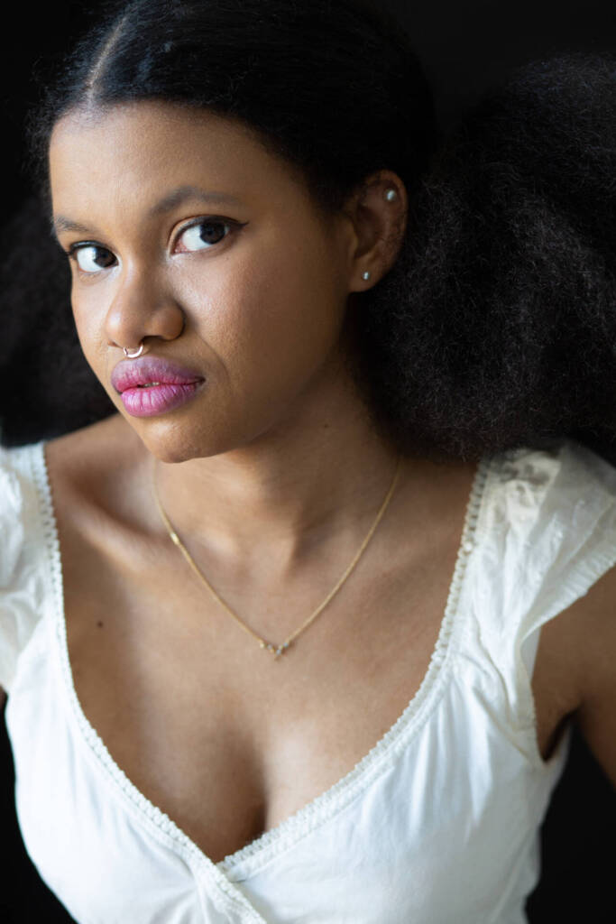 Headshot of a woman in a white dress wearing septum piercing facing the camera - Tokyo Portrait Photographer, Headshot photos