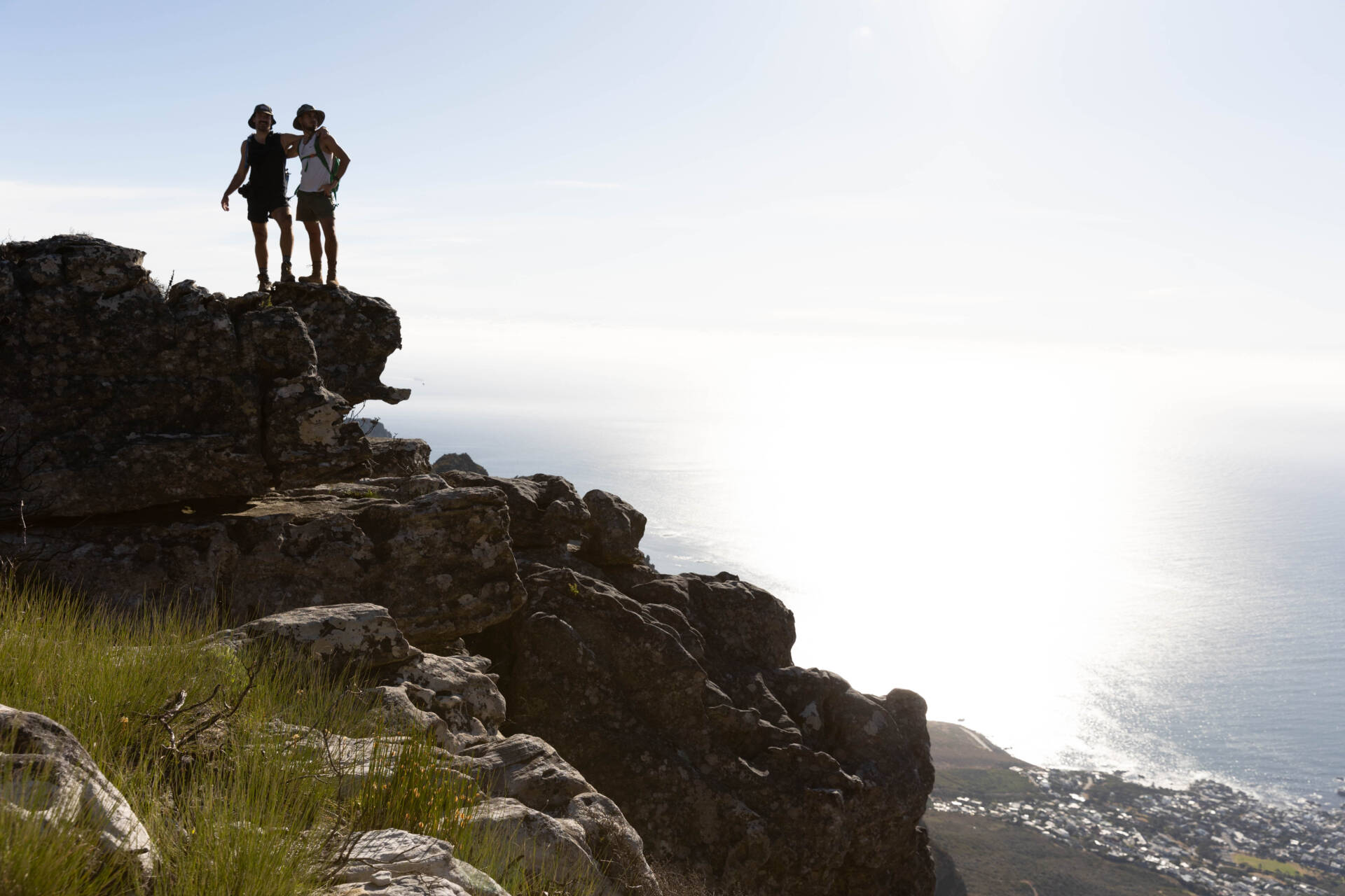 A long shot of two men on the cliff top near the beach posing in camera, Tokyo Portrait Photographer, Photographer in Tokyo