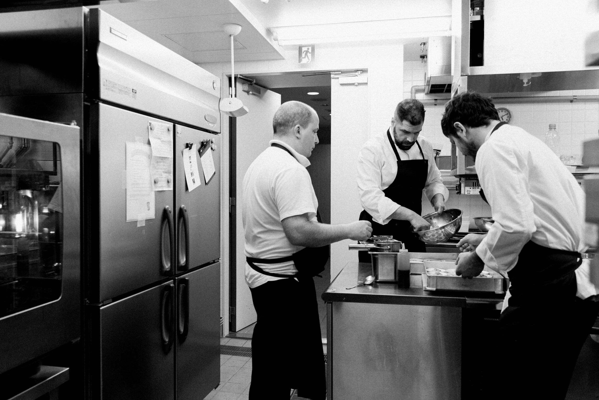 Black & White Shot of the Catering staff preparing food inside a hotel kitchen - Event photographer, Tokyo Event Photography