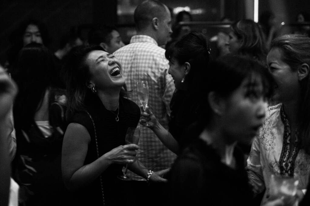 Black and white portrait of happy women at a party while drinking whine - Event photographer, Tokyo Event Photography