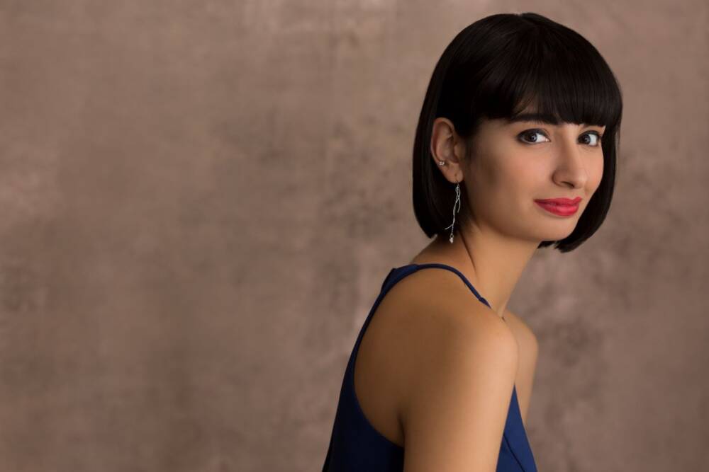 Portrait photography of a short-haired woman with a soft smile feature, soft blur - Classic portrait shots