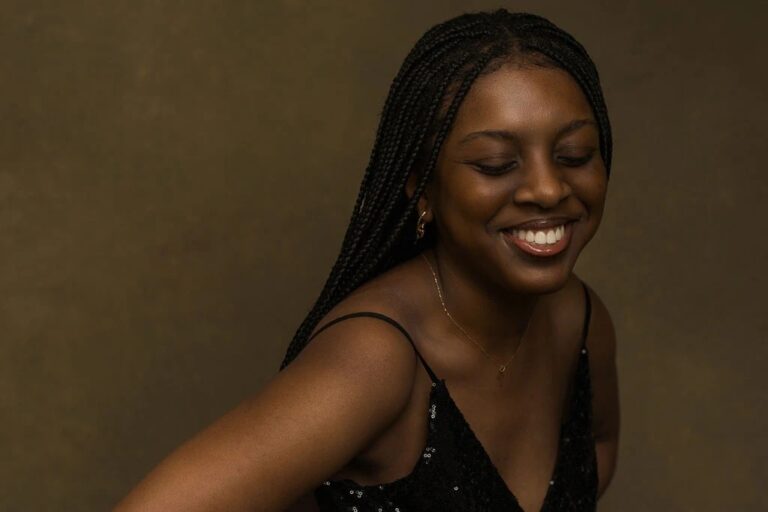 Woman smiling with eyes closed, turning slightly toward camera in a portrait moment. — Branding / Headshots, a session in Tokyo