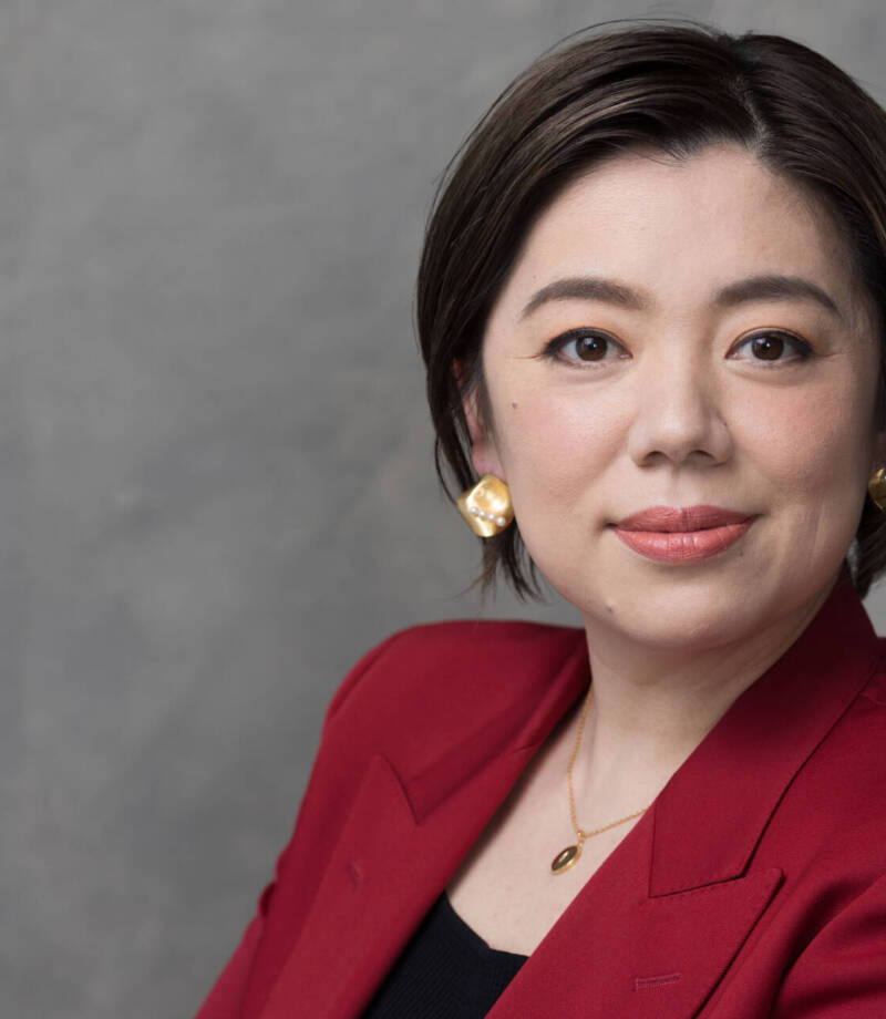 Clear Headshot of a professional mature woman in a red suit coat facing the camera - Charlotte Portrait Photographer