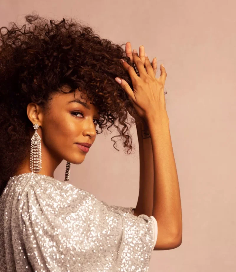 A young pretty woman wearing a shiny outfit, in a unique curly hairstyle, posing for a magazine photo - Model Headshot, Tokyo Portrait Photographer, Photographer in Tokyo