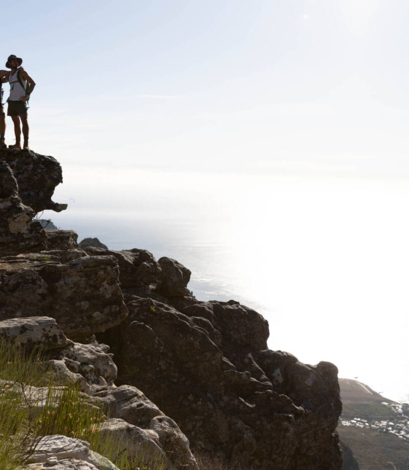 A long shot of two men on the cliff top near the beach posing in camera, Tokyo Portrait Photographer, Photographer in Tokyo