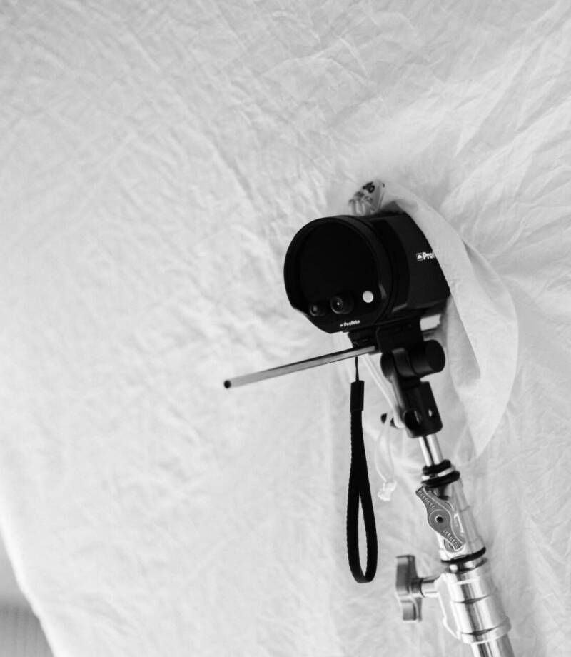 A professional studio setup with a light reflector fabric and a camera mounted on a stand - Tokyo Portrait Photographer